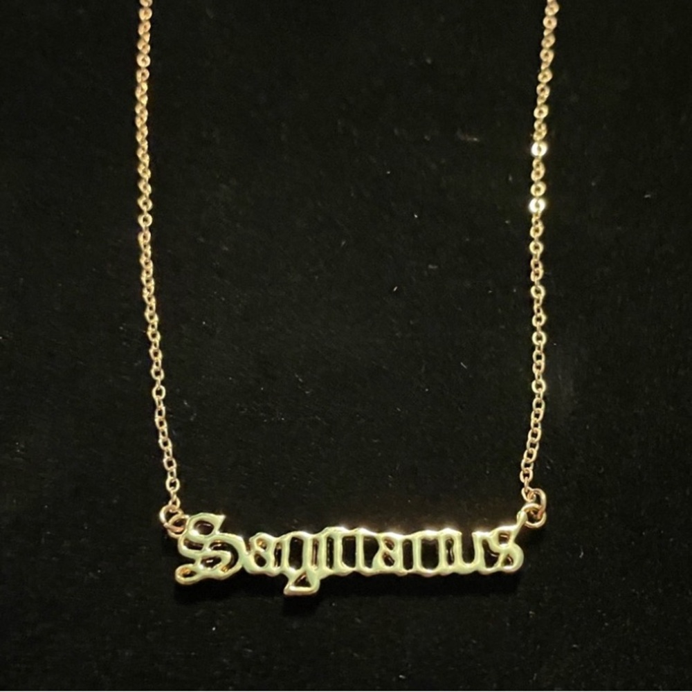 Gold plated Sagittarius nameplate necklace. Brand new, in perfect condition